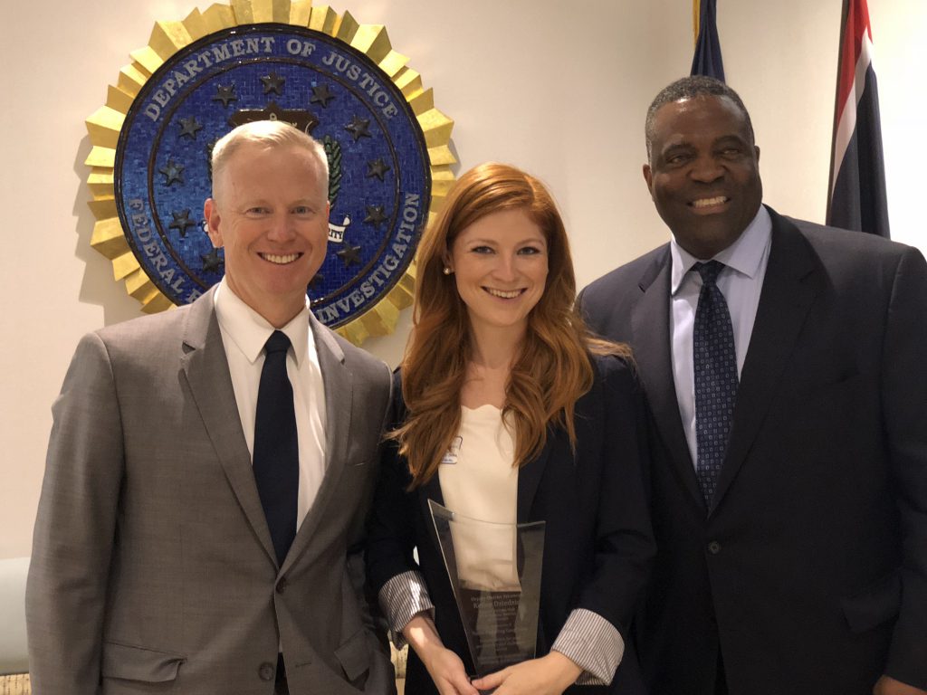 District Attorney George Brauchler, Kelley Dziedzic, and FBI Special Agent in Charge Calvin Shivers